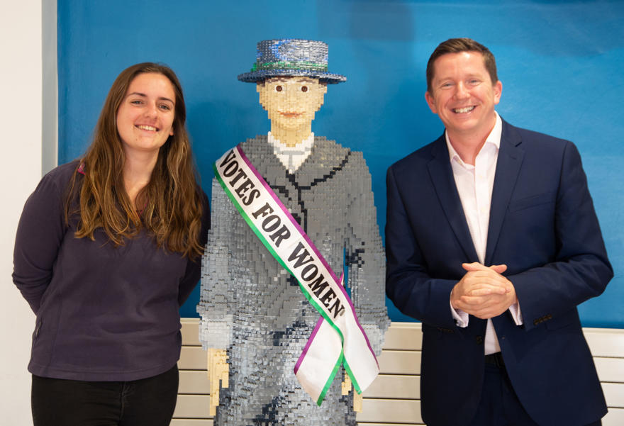 Ross Renton and Meghan from the student's Union with the lego suffragette
