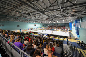 view from the back row of spectators looking towards a sports court