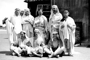eight sheikh men standing in a group