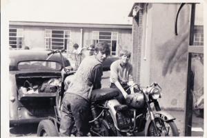 Two men on a motorbike in the 1960s