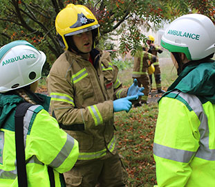 Discussion between three emergency service personnel