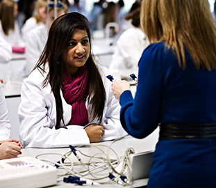 white coated student in a laboratory